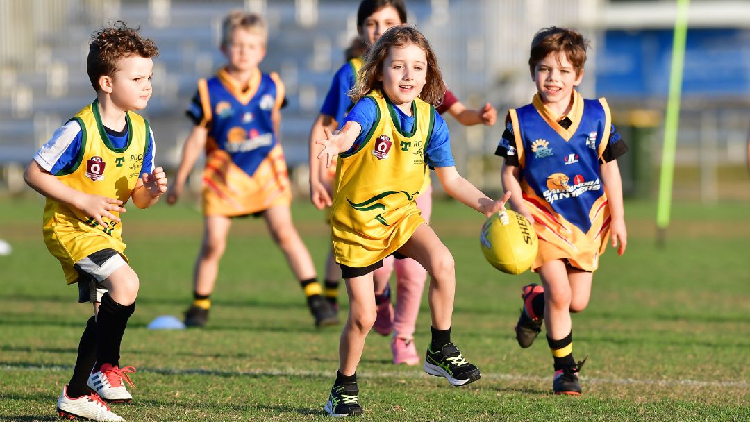 Kids playing auskick with AFL Queensland