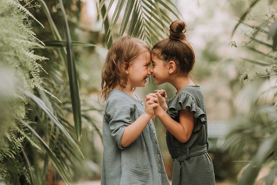Education Fair sponsor - two young girls hugging