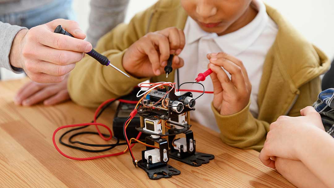 Kids building robot as part of STEAM activities for kids